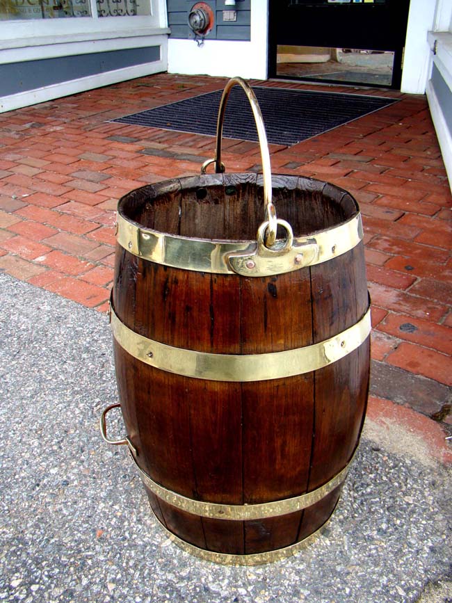 A fine 19th century English brass bound oak barrel with both a side and top mounted handle